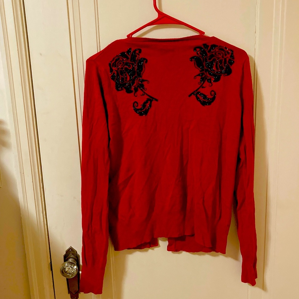 Red cardigan with black sparkly rose
